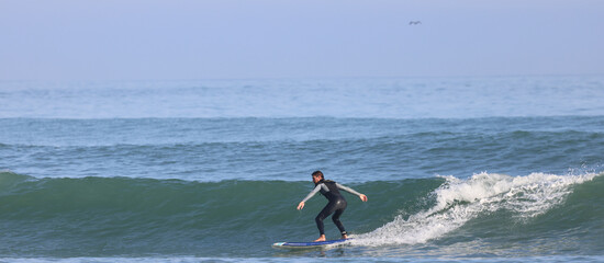 surfer catching a wave 