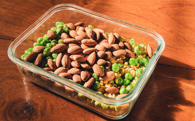  almond, Dried Soybeans, and Crispy Green Peas in a glass cup, Mixed grains for a good source of protein, vitamins, and good health. 