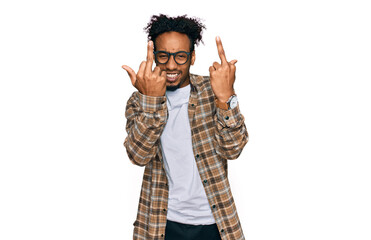 Young african american man with beard wearing casual clothes and glasses showing middle finger...