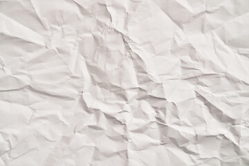 White crumpled paper texture with wrinkles. Damaged and torn sheet