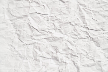 White crumpled paper texture with wrinkles. Damaged and torn sheet