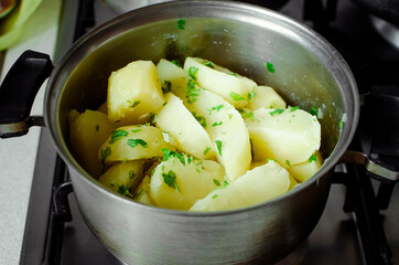 Boiled potatoes in a saucepan, cooking at home.