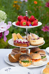 Afternoon tea with cakes and sandwiches