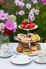 Afternoon tea with cakes and sandwiches