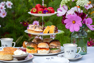 Afternoon tea with cakes and sandwiches
