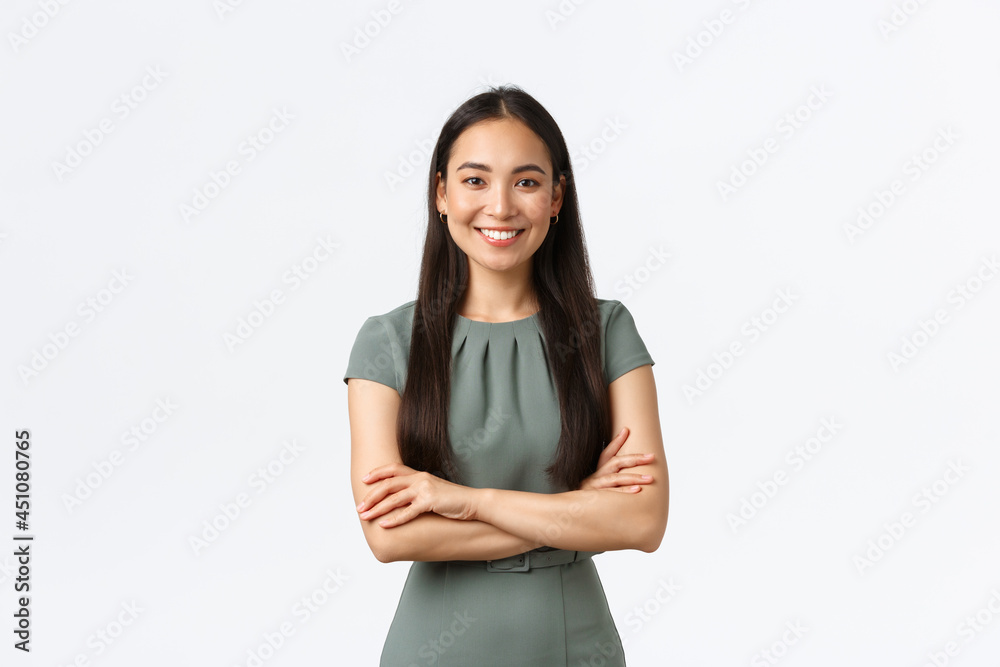 Wall mural Small business owners, women entrepreneurs concept. Confident young asian woman starting startup, managing online store and work from home, standing confident with arms crossed, smiling pleased