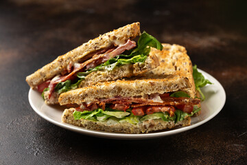 Fresh BLT Sandwiches with Bacon Lettuce and Tomato on white plate