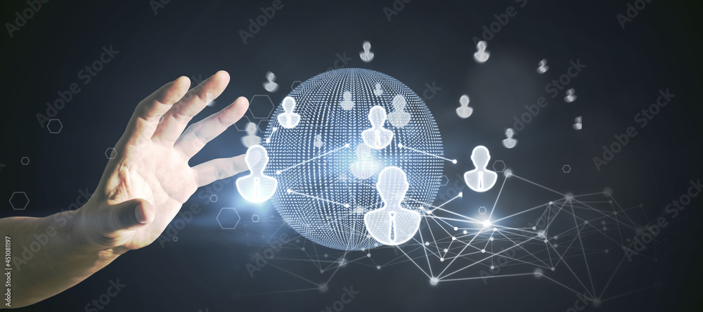 Poster Hand using glowing globe interface with people icons on dark background. Social networking and recruiting concept.