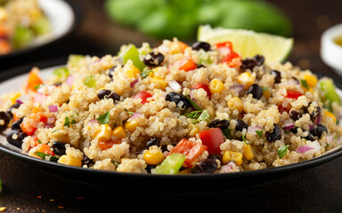 Quinoa black bean salad with corn, red green pepper, onion. Healthy food.
