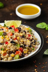 Quinoa black bean salad with corn, red green pepper, onion. Healthy food.