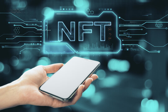 Close up of hand holding empty white smartphone with glowing NFT chip hologram on blurry bokeh background. Non-fungible token and crypto currency concept. Double exposure. - Powered by Adobe