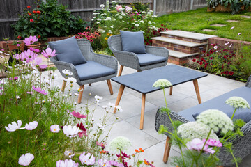 Outdoor living, terrace in the garden with flowers