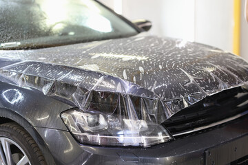 Polyurethane vinyl film pasted on hood of car closeup