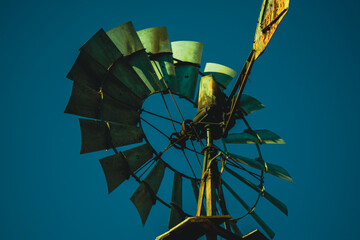 Macro still shot of a rustic windmill on an old country ranch  © SageOil