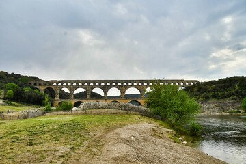 bridge over the river, photo as a background , in Pont du gard, gardon, nimes france