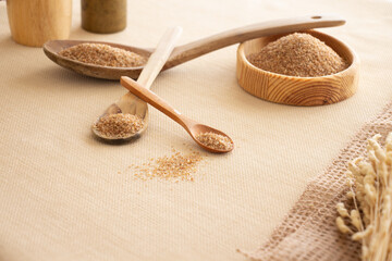 brown bulgur wooden bowl and spoon on table