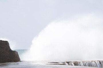 waves crashing on rocks