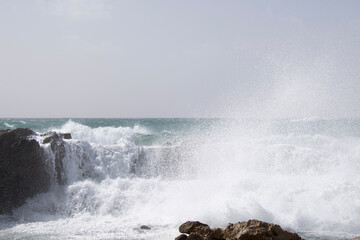 waves crashing on rocks