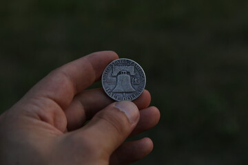 Vintage American coin half dollar in hand
