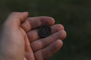 Vintage Italian coin in hand