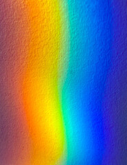 Light spectrum reflected through crystal prism on a wall