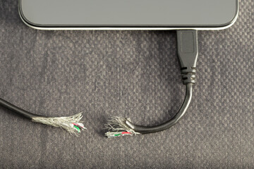 Gnaw or cut out Damaged peripheral wire ,trouble connection transfer on mobile device. Concept...