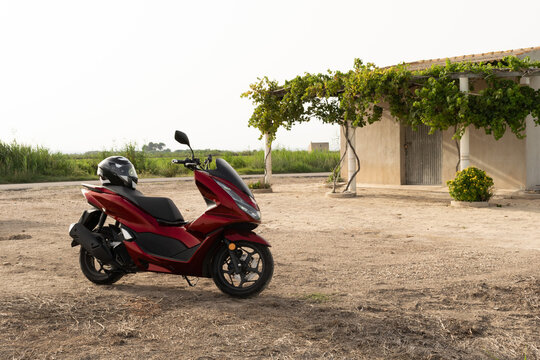 Motorcycle on the road in the sunlight. Adventure freedom as a solo motorcyclist on the road. Shallow depth of field.