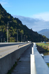 bridge transited by vehicles and people in the first hours of the day