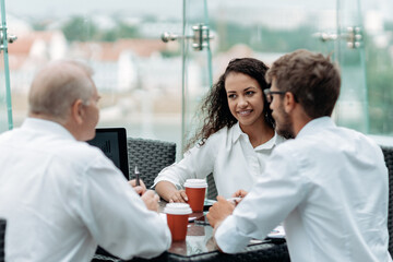young business woman shaking hands with her business partner.