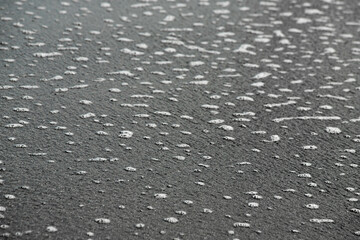 white sea foam near the shore close-up, waves