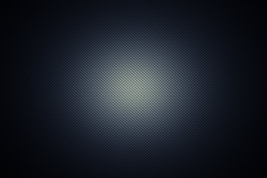 Dark blue molded embossed metal industrial background with a spot of light in the center