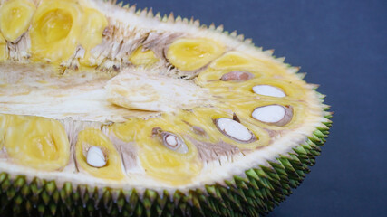 Slice of jackfruit on a dark background