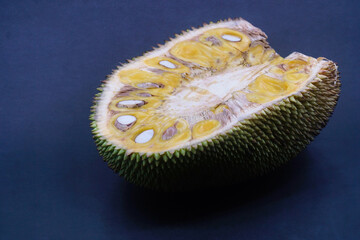 Slice of jackfruit on a dark background