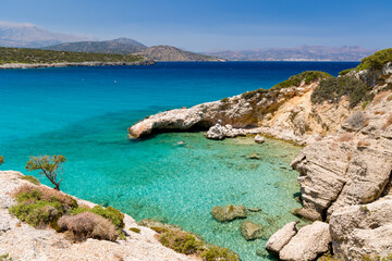 Fototapeta na wymiar Crystal clear warm waters and beaches in summer (Voulisma Beach, Crete, Greece)