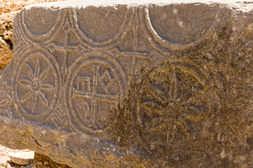 Ancient inscriptions on a stone slab at the ruins of Itanos on Crete, Greece