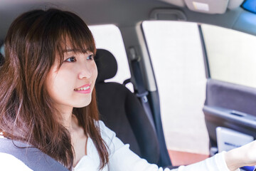 Young woman driving a car