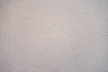 Tan stucco wall backfround surface pattern