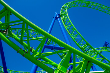 blue green rollercoaster tracks fair ride