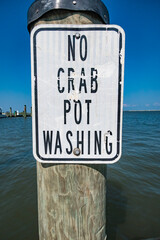 Deal Island, Maryland USA A sign in the harbor says No crab pot washing.