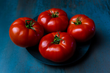 red tomatoes in textured background