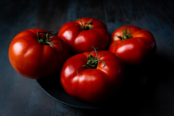 red tomatoes in textured background