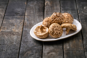 Fresh Shiitake Mushroom on wooden background