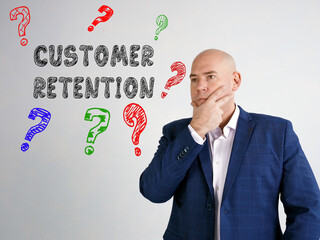Business concept about CUSTOMER RETENTION question marks with inscription on the wall