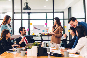 Group of professional success asian business meeting and discussing strategy with new startup project.Creative business people planning and brainstorm with laptop computer in modern office.Teamwork