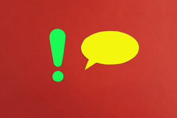 The exclamation mark is green, the oval for the text is yellow on a red background. Drawing attention, communicating information.