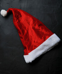 red santa claus hat on dark background