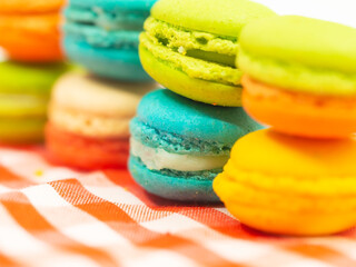 Colorful macaron cookies on white background, select and soft focus