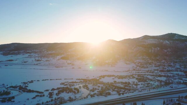 Beautiful Winter Morning Sunset From The Mountains In Steamboat Springs, Colorado, USA. - Aerial Drone Shot, Pull-back Reveal