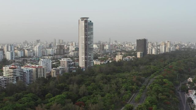 Drone flying over the Mirador Sur Park towards the Caney Tower, Santo Domingo