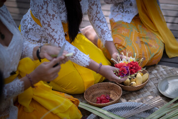 Canang Sari an Offering to God made by Balinese Hindus. Traditional hindu banten with flowers and...
